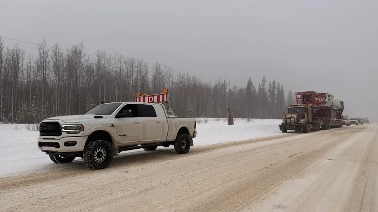 Following a load down a snowy lease road