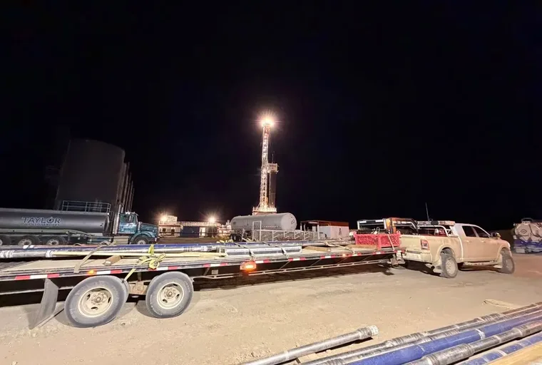 Rig lit up on a night move