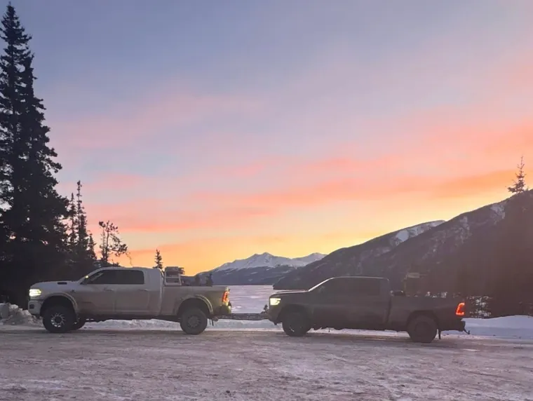 Two trucks at sunset, end of a move