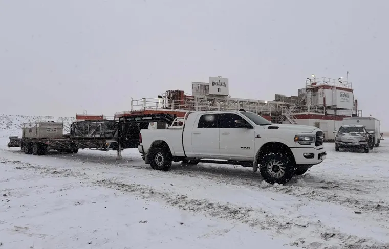 Trucks staged on a snowy lot